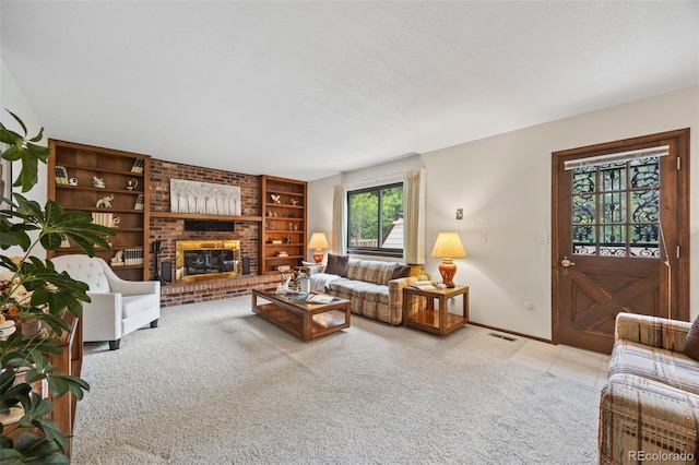4677 S Wolff St, Denver, CO 80236 - carpeted living area with built in shelves and a fireplace