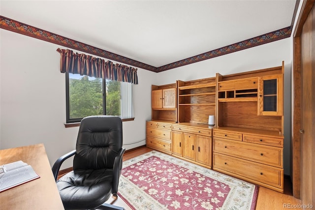 4677 S Wolff St, Denver, CO 80236 - home office with light wood finished floors and baseboard heating