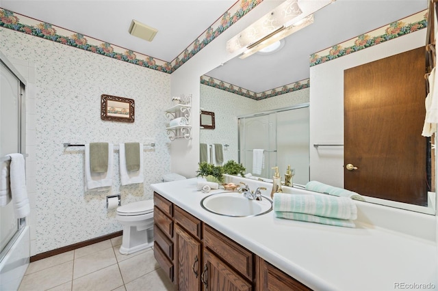 4677 S Wolff St, Denver, CO 80236 - bathroom featuring vanity, tile patterned flooring, wallpapered walls, and bath / shower combo with glass door