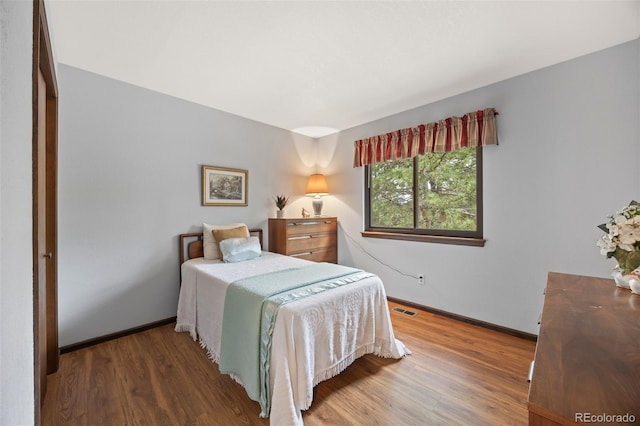4677 S Wolff St, Denver, CO 80236 - bedroom with wood finished floors and baseboards