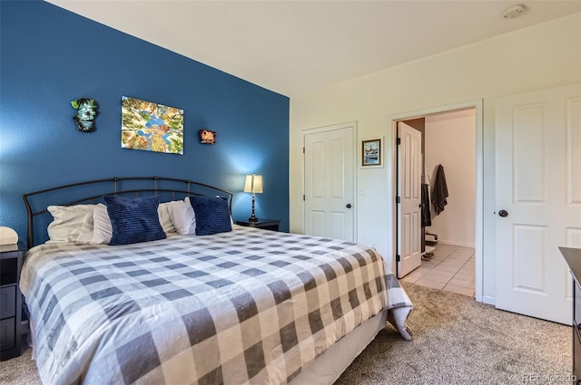 8445 S Holland Way Unit 205, Littleton, CO 80128 - bedroom with light colored carpet and light tile patterned flooring