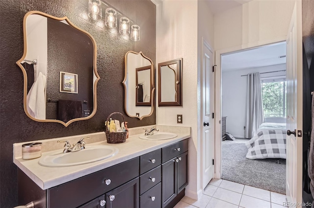 8445 S Holland Way Unit 205, Littleton, CO 80128 - full bathroom with tile patterned floors, double vanity, and ensuite bath