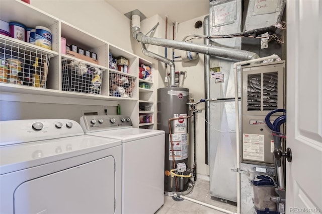 8445 S Holland Way Unit 205, Littleton, CO 80128 - laundry area with gas water heater, washing machine and dryer, and light tile patterned floors