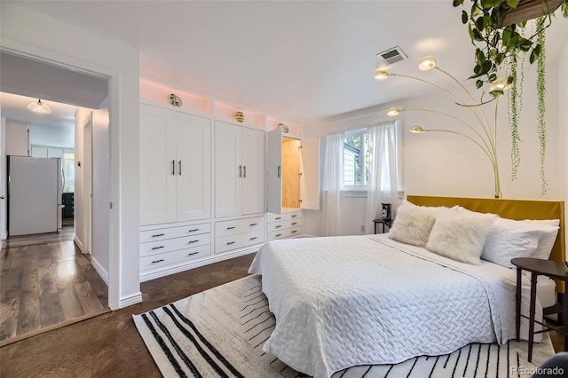 947 S Yates St, Denver, CO 80219 - bedroom with freestanding refrigerator, a closet, and baseboards