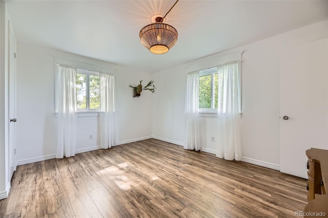947 S Yates St, Denver, CO 80219 - spare room with wood finished floors and baseboards
