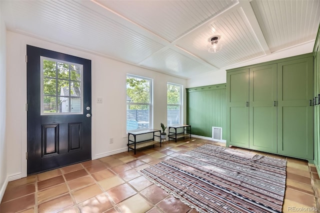 947 S Yates St, Denver, CO 80219 - entryway featuring healthy amount of natural light, baseboards, wooden ceiling with exposed beams, and light tile patterned flooring