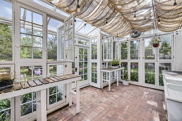 947 S Yates St, Denver, CO 80219 - sunroom with brick flooring and french doors