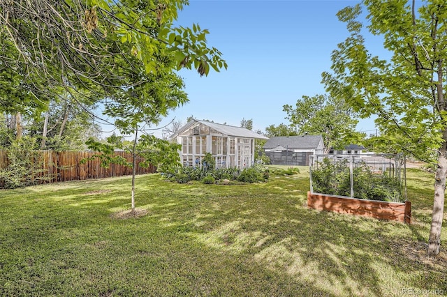 947 S Yates St, Denver, CO 80219 - view of yard with a garden and an outbuilding