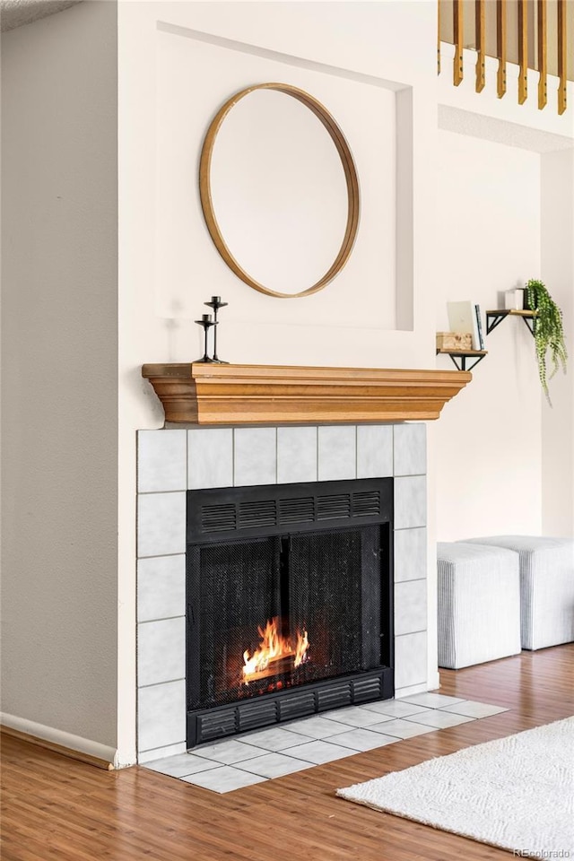 923 S Fairplay St, Aurora, CO 80012 - detailed view of a fireplace, wood finished floors, and radiator heating unit