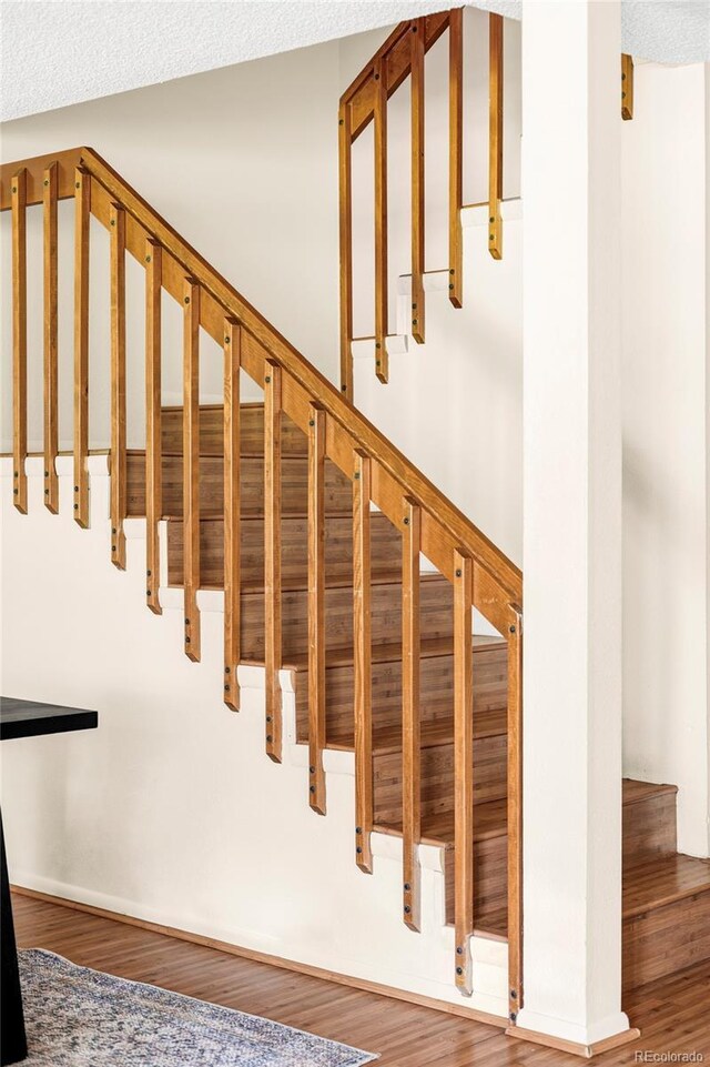 923 S Fairplay St, Aurora, CO 80012 - stairway featuring wood finished floors