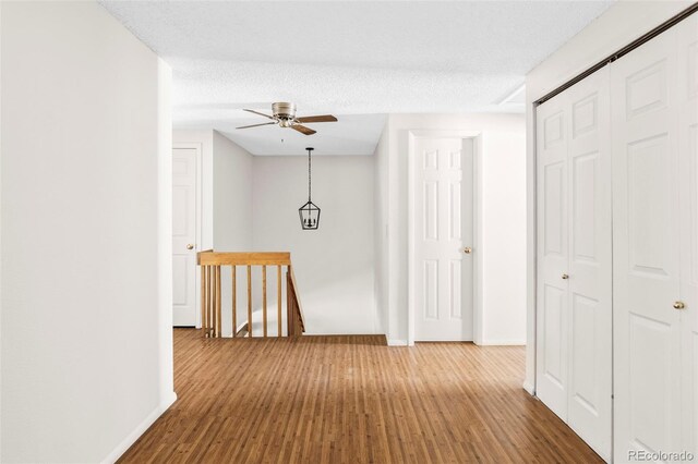 923 S Fairplay St, Aurora, CO 80012 - hall with wood finished floors and an upstairs landing