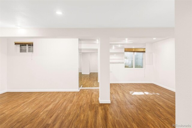 923 S Fairplay St, Aurora, CO 80012 - below grade area featuring wood finished floors and recessed lighting