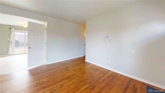 empty room with wood-type flooring