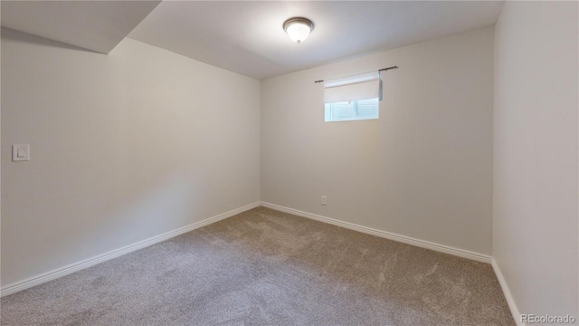 unfurnished room featuring carpet flooring