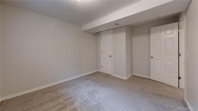 unfurnished bedroom featuring light colored carpet