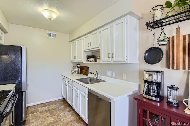 kitchen with visible vents, open shelves, a sink, white cabinets, and appliances with stainless steel finishes