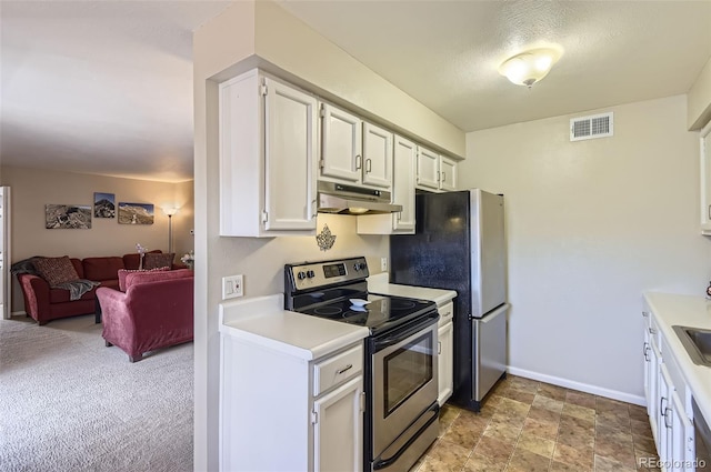 kitchen with visible vents, under cabinet range hood, light countertops, appliances with stainless steel finishes, and white cabinets