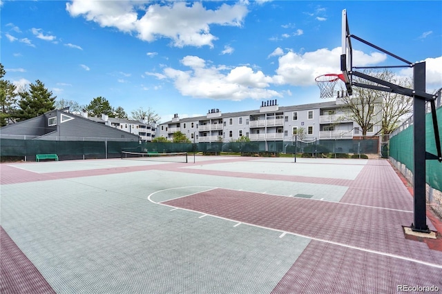 view of sport court with community basketball court, fence, and a tennis court