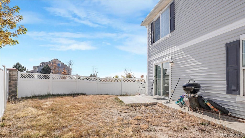 21296 E 55th Pl, Denver, CO 80249 - fenced backyard featuring a patio