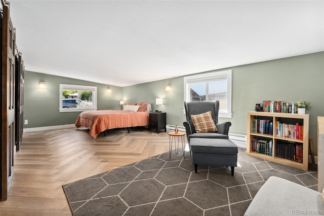 bedroom with baseboards and a baseboard radiator