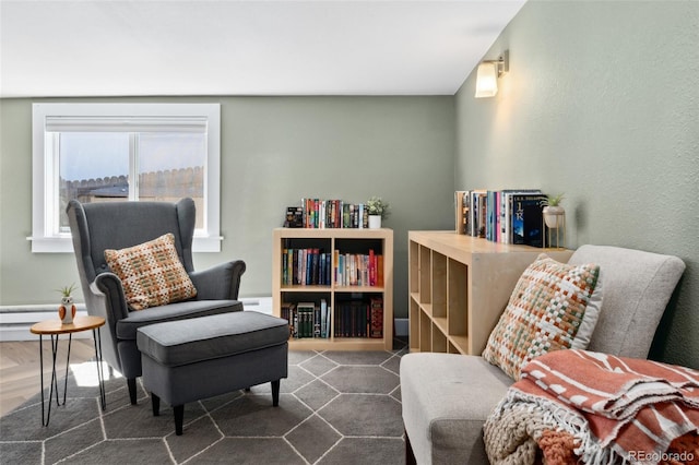 sitting room featuring baseboard heating