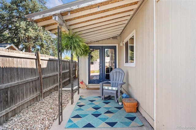 view of patio / terrace with fence and french doors