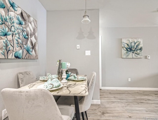 8330 Zuni St Unit 116, Denver, CO 80221 - dining room featuring wood finished floors and baseboards