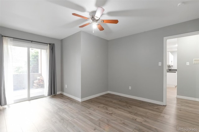 8330 Zuni St Unit 116, Denver, CO 80221 - spare room featuring a ceiling fan and wood finished floors