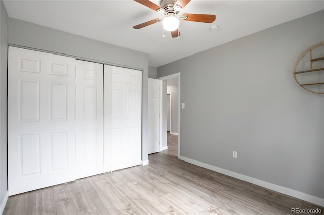 8330 Zuni St Unit 116, Denver, CO 80221 - unfurnished bedroom with a closet, light wood-style flooring, and a ceiling fan