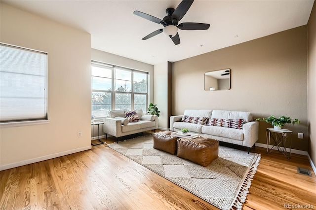 453 S Quay St, Lakewood, CO 80226 - living room featuring visible vents, a ceiling fan, baseboards, and wood finished floors