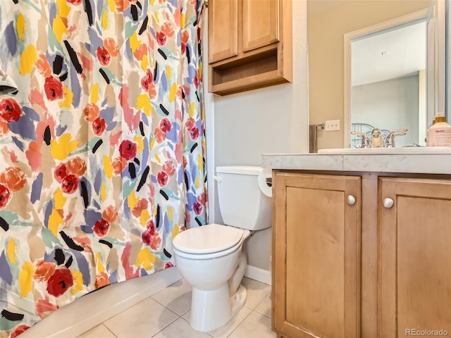 453 S Quay St, Lakewood, CO 80226 - bathroom with vanity, tile patterned flooring, baseboards, and toilet