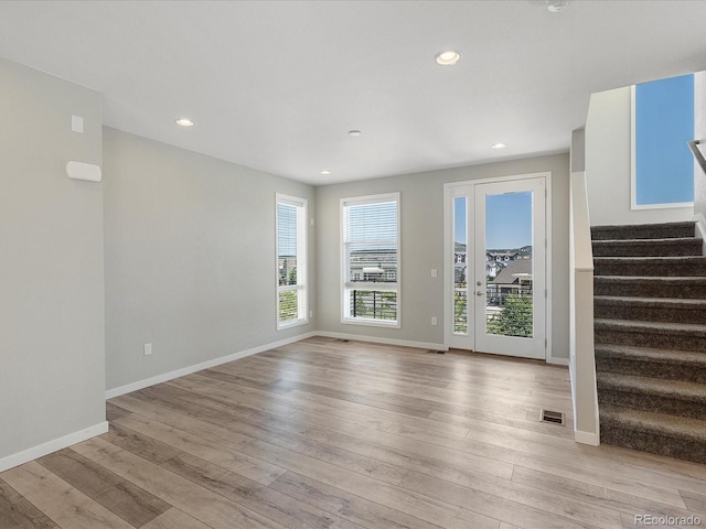 3654 Penang Dr, Castle Rock, CO 80109 - spare room with light wood-style flooring, stairs, and recessed lighting