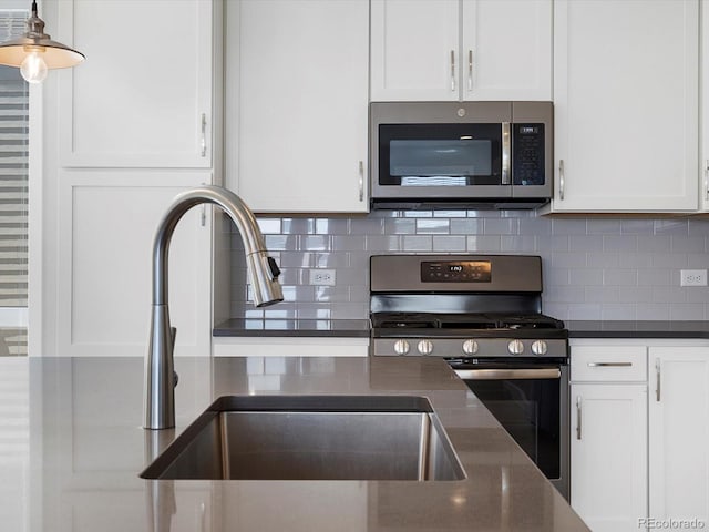 3654 Penang Dr, Castle Rock, CO 80109 - kitchen with stainless steel appliances and white cabinets
