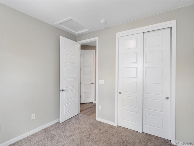 3654 Penang Dr, Castle Rock, CO 80109 - unfurnished bedroom featuring carpet flooring, a closet, and attic access