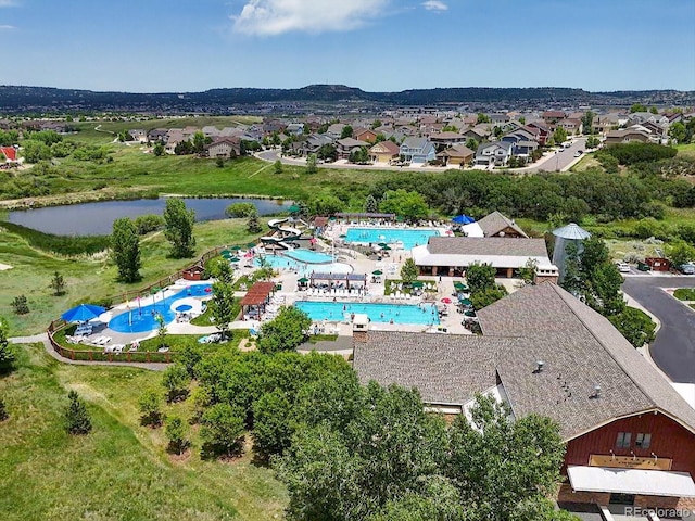 3654 Penang Dr, Castle Rock, CO 80109 - drone / aerial view of a pool area and a nearby body of water