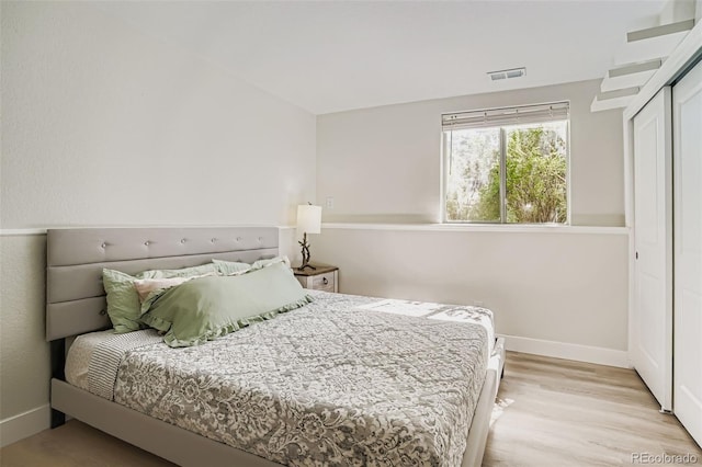 17630 E Loyola Dr Unit 1812L, Aurora, CO 80013 - bedroom with wood finished floors and a closet