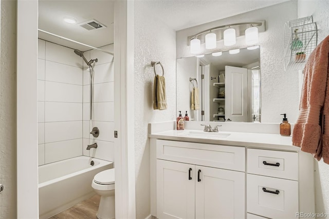 17630 E Loyola Dr Unit 1812L, Aurora, CO 80013 - bathroom featuring a textured wall, vanity,  shower combination, and wood finished floors