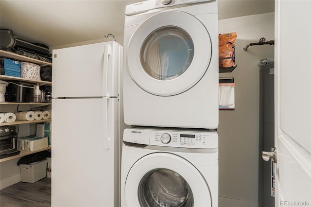 17630 E Loyola Dr Unit 1812L, Aurora, CO 80013 - laundry area featuring stacked washing machine and dryer and wood finished floors