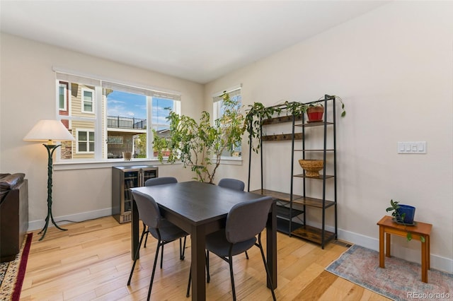 671 Robert St, Longmont, CO 80503 - dining space with light wood-style flooring and baseboards