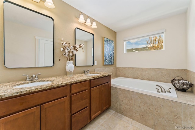 671 Robert St, Longmont, CO 80503 - bathroom featuring double vanity, a garden tub, and tile patterned floors