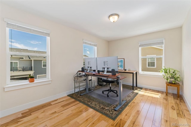 671 Robert St, Longmont, CO 80503 - home office with wood finished floors and baseboards