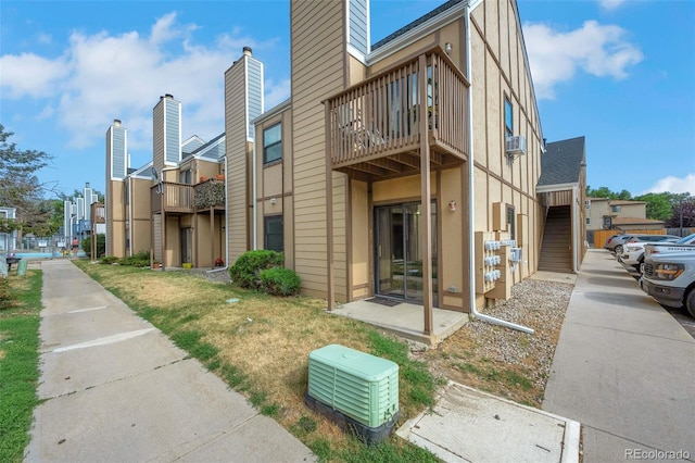 225 E 8th Ave Unit 10, Longmont, CO 80504 - view of building exterior with cooling unit and a residential view
