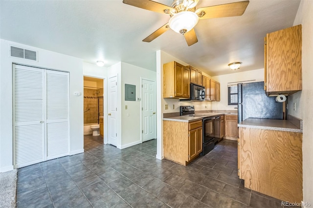 225 E 8th Ave Unit 10, Longmont, CO 80504 - kitchen with black appliances, electric panel, a ceiling fan, and light countertops