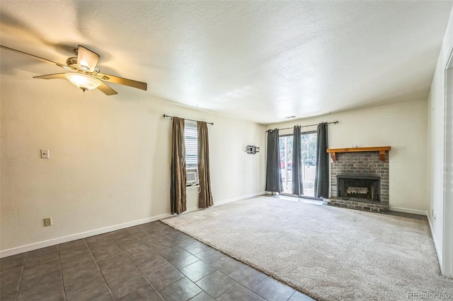 225 E 8th Ave Unit 10, Longmont, CO 80504 - unfurnished living room with ceiling fan, a fireplace, and a textured ceiling
