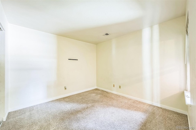 225 E 8th Ave Unit 10, Longmont, CO 80504 - spare room featuring carpet and baseboards
