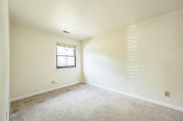 225 E 8th Ave Unit 10, Longmont, CO 80504 - unfurnished room featuring carpet and baseboards