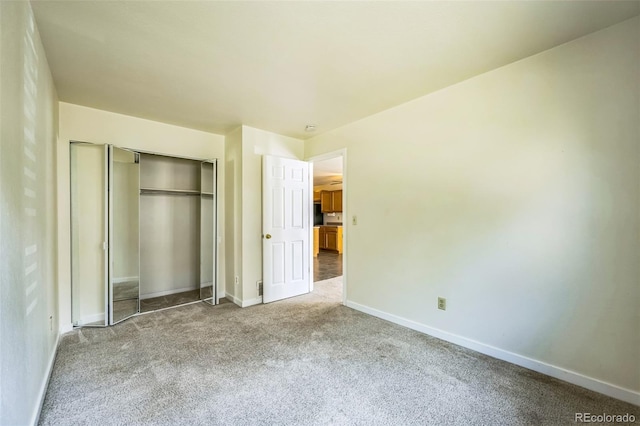 225 E 8th Ave Unit 10, Longmont, CO 80504 - unfurnished bedroom with carpet and a closet