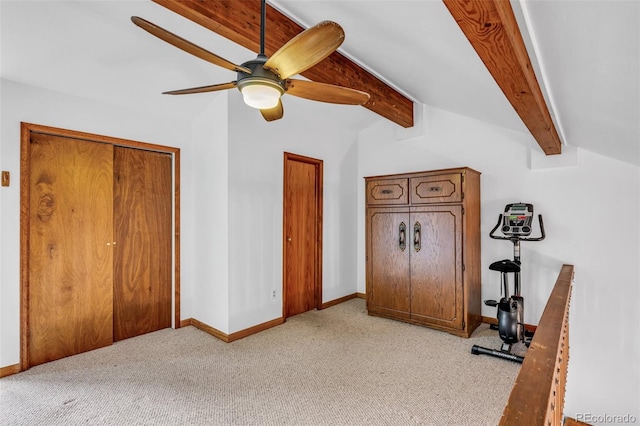 carpeted bedroom featuring ceiling fan and vaulted ceiling with beams