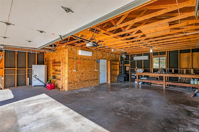 garage featuring a garage door opener and refrigerator