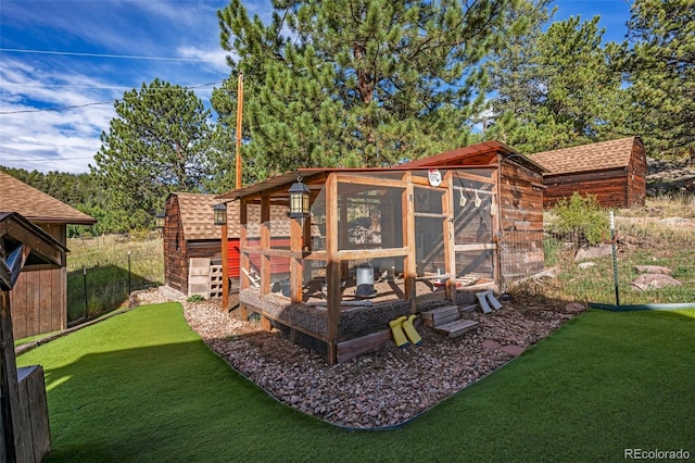 view of outbuilding with a yard